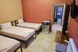 Postel nebo postele na pokoji v ubytování Senat Hotel