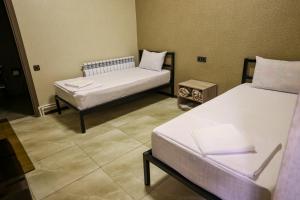 Postel nebo postele na pokoji v ubytování Senat Hotel