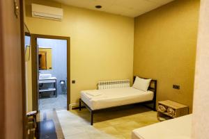 Postel nebo postele na pokoji v ubytování Senat Hotel