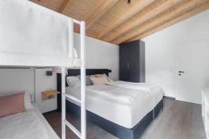 Uma cama ou camas num quarto em Michal