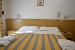 Postel nebo postele na pokoji v ubytování Hotel Altinate