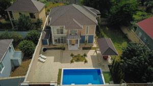 an aerial view of a house with a swimming pool at Rest Paradise Villa Gabala in Gabala