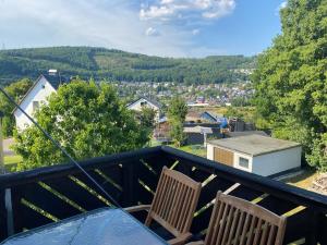 a view from the balcony of a house with two chairs at Maisonette - apartment in Siegen in Siegen