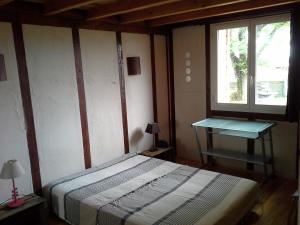 Ένα ή περισσότερα κρεβάτια σε δωμάτιο στο Gîte de la faure +2 φωτογραφίες