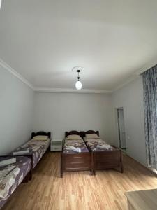 Letto o letti in una camera di Temo's guest house in Kvariati