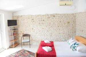 Postel nebo postele na pokoji v ubytování Gartenapartment Villa Luger + 37 fotografií