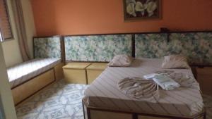 Ένα ή περισσότερα κρεβάτια σε δωμάτιο στο Hotel New Plaza