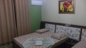 Ένα ή περισσότερα κρεβάτια σε δωμάτιο στο Hotel New Plaza