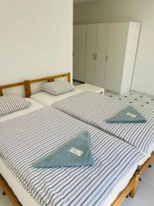 Postel nebo postele na pokoji v ubytování Residence Meljska