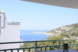 a view of the ocean from the balcony of a house at Villa Luger 2 Dachgeschoss in Rogoznica
