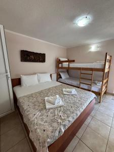 Postel nebo postele na pokoji v ubytování Apartmani Teodora