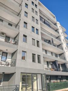 a large apartment building with windows and balconies at Seven Apartament in Mangalia