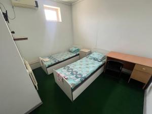 Postel nebo postele na pokoji v ubytování Green Hostel