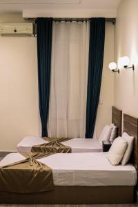 En eller flere senge i et værelse på Cairo Villa Hotel + 4 billeder