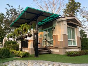 Κήπος έξω από το บ้านนิมิตรีสอร์ท