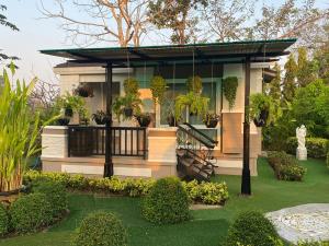 Κήπος έξω από το บ้านนิมิตรีสอร์ท