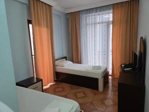 Postel nebo postele na pokoji v ubytování Kazbegi Hotel Batumi