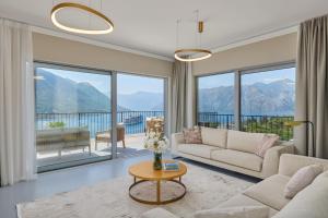 a living room with a couch and a table at Sea Breeze Residence in Kotor