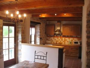 a kitchen with a counter top in a room at Gîte Le Pigeonnier10P, Ste Enimie,Gorges du tarn, village de Saint Chély du Tarn 