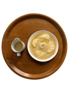 a plate with a bowl of food and a cup of coffee at WALET PARADISE Ceningan Villa in Nusa Lembongan +28 photos