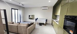 a living room with a couch and a table at Seaside Escape - 50 m to shore 2 in Golem