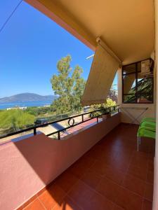 a balcony with a view of the ocean at Villa Edi in Vlorë