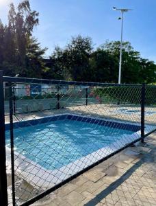 a tennis court with a net on a tennis court at Giannas stays 2br in Mombasa