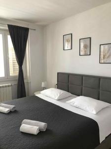 Postel nebo postele na pokoji v ubytování Apartmani Lukas