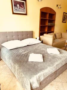 Postel nebo postele na pokoji v ubytování ART hotel MAXIM