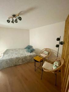 Ένα ή περισσότερα κρεβάτια σε δωμάτιο στο Le Paradis