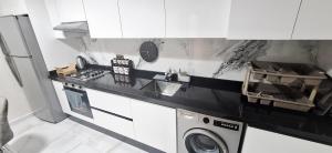 Kuchyň nebo kuchyňský kout v ubytování Appartement 2 luxueux vue mer