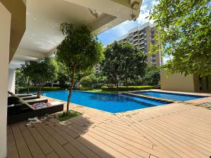 a swimming pool in front of a building at Tower C 3rd Floor in Taytay +3 photos