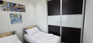 Voodi või voodid majutusasutuse Hotel Flamingo 1 toas