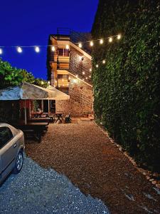 a house with a tent and lights on it at Casa Nicolas in Costinesti