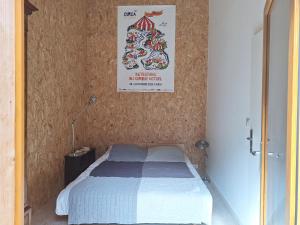 Ένα ή περισσότερα κρεβάτια σε δωμάτιο στο Théveny, Le Levant