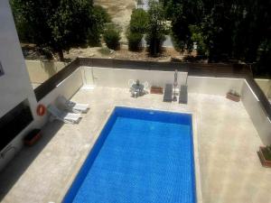 an overhead view of a swimming pool on a building at Sofia`s place in Oroklini