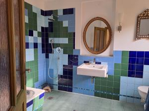 a bathroom with a sink and a mirror at Haus an der Stadtmauer in Lychen +16 photos