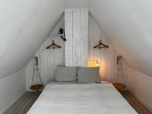 Postel nebo postele na pokoji v ubytování Zoute Zeelucht