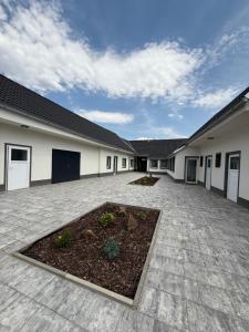 a building with a courtyard with a garden in it at Chalupa Jaroslavice in Jaroslavice