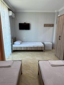 Postel nebo postele na pokoji v ubytování Hotel Mia