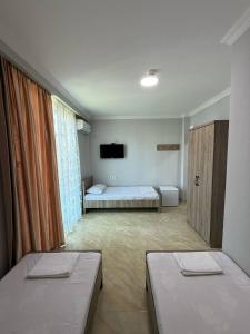 Postel nebo postele na pokoji v ubytování Hotel Mia