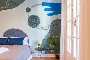 a bedroom with a bed and a window at Fliphaus Mansion Paz B - 10 pax Deluxe House Belgrano in Buenos Aires +8 photos