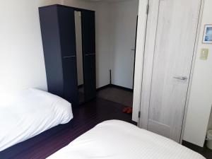 Postel nebo postele na pokoji v ubytování Ace Inn Asakusa