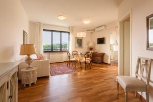 a living room with a couch and a table at GOLDEN LUXE - Royal Sea View Private Parking in Marina di Pietrasanta