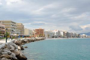 a view of a beach in a city with buildings at Onda Blu Deluxe Loutraki in Loutraki