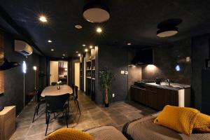a room with a kitchen and a table in it at Hotel-Mercurius-Azabujuban-RB in Tokyo
