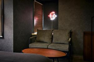 a living room with a couch and a table at Hotel-Mercurius-Azabujuban-RB in Tokyo