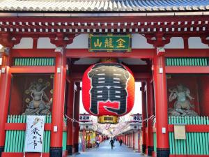 a building with a sign with a face on it at Hotel-Mercurius-Azabujuban-RB in Tokyo