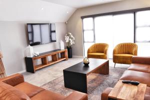 a living room with a couch and a coffee table at Stella Maris #4 Self-catering in Swakopmund