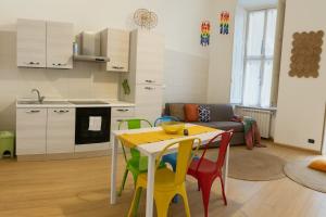 a kitchen and living room with a table and chairs at Casa vivace in centro Torino by Turin House Collection in Turin